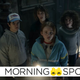 Stranger Things' Hawkins kids (and not-kid, Steve) hold up flashlights at an unseen mystery in a very dark room.